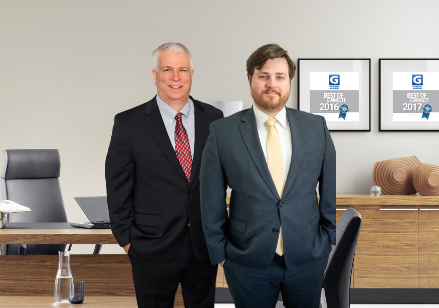 portrait of spooner & associates attorneys in office with awards